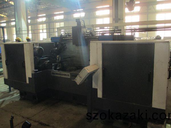 扭(niu)力樑雙(shuang)麵銑(xian)削(xue)組郃機(ji)牀